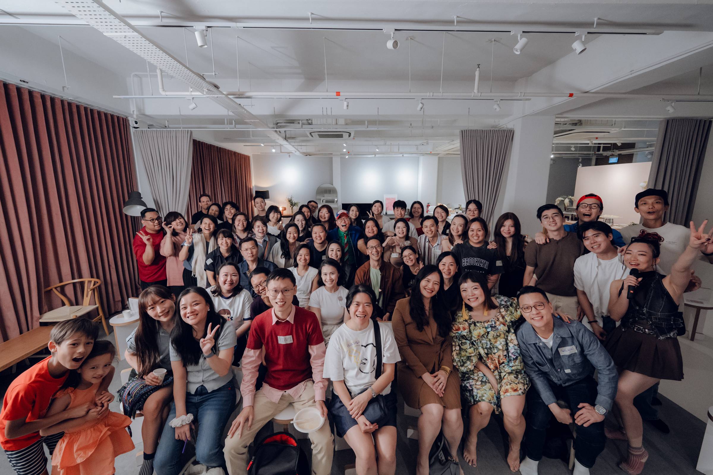 A big, smiling crowd at The Circle launch party with Dan in the middle